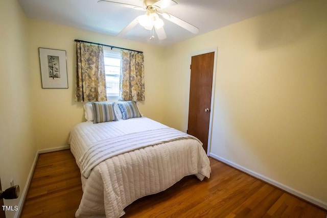 505 E Graham St, Mebane, NC 27302 - bedroom with wood finished floors and ceiling fan