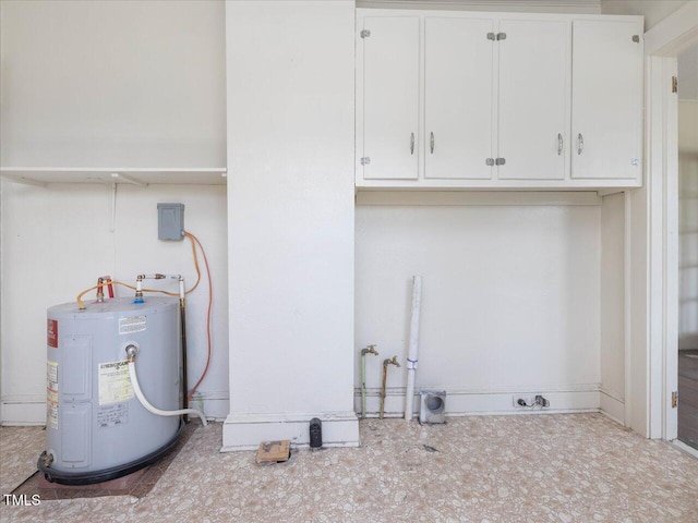 laundry area with cabinet space and electric water heater