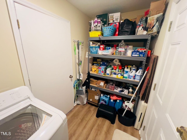 laundry area with washer / dryer, laundry area, and wood finished floors