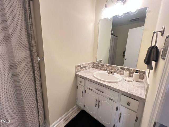 full bathroom featuring vanity, decorative backsplash, visible vents, and tile patterned floors