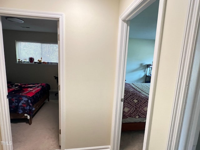 hall with carpet floors
