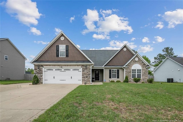 1114 Legend Creek Dr, Hope Mills, NC 28348 - craftsman-style house featuring central air condition unit, concrete driveway, stone siding, and a front lawn