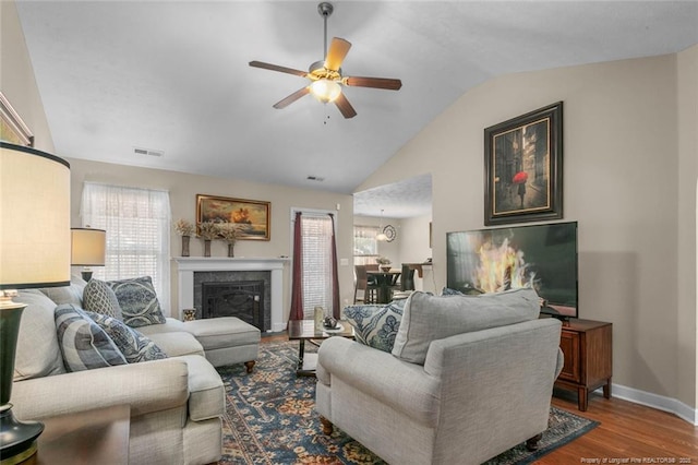 1114 Legend Creek Dr, Hope Mills, NC 28348 - living area featuring ceiling fan, wood finished floors, a healthy amount of sunlight, lofted ceiling, and baseboards