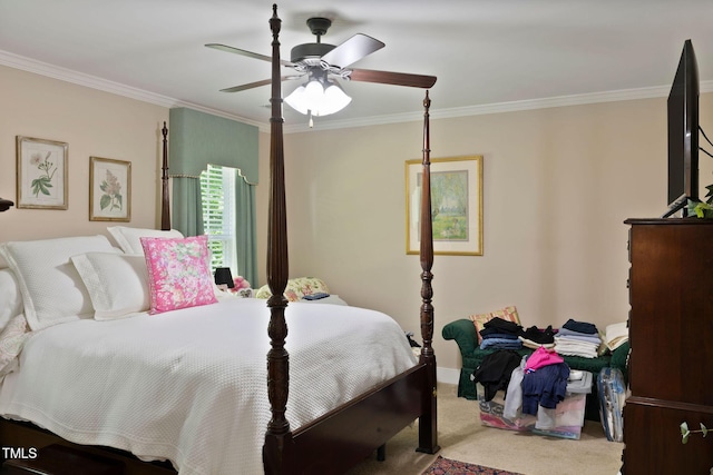 carpeted bedroom featuring a ceiling fan, baseboards, and ornamental molding