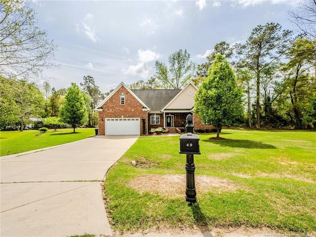 view of front facade with a garage, driveway, a front lawn, and brick siding