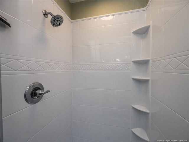 full bathroom with tiled shower