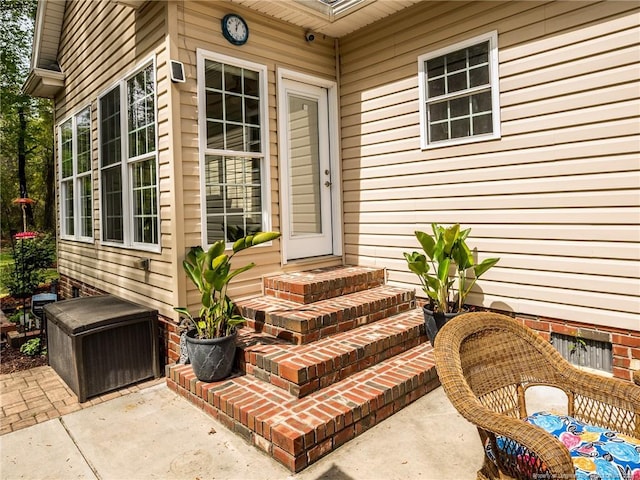 doorway to property with a patio area