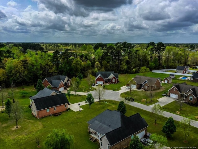 aerial view featuring a wooded view