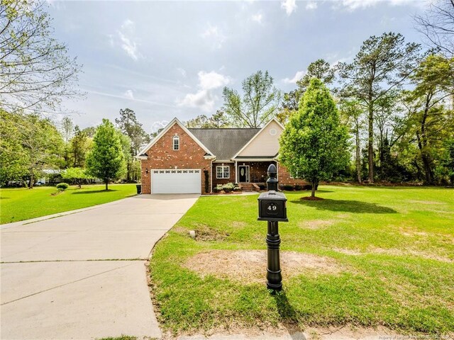49 Alyssa Ct, Lumberton, NC 28360 - traditional-style home with brick siding, an attached garage, a front yard, and driveway