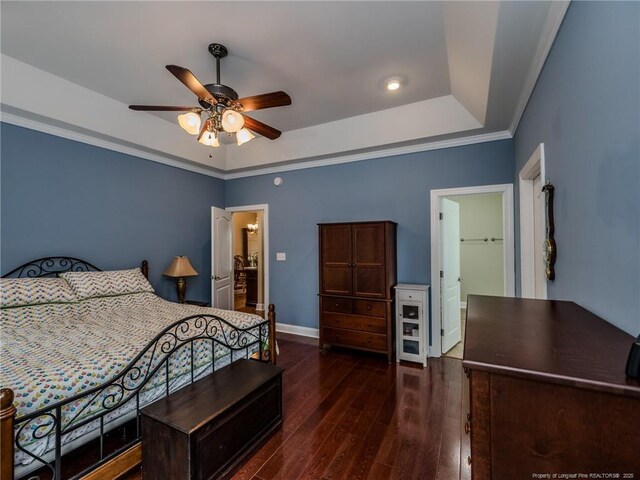 49 Alyssa Ct, Lumberton, NC 28360 - bedroom featuring a raised ceiling, wood-type flooring, baseboards, crown molding, and ceiling fan