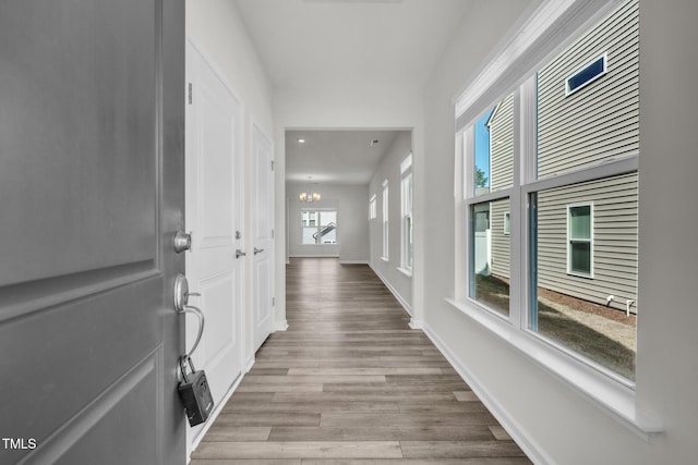 1412 Smoky Mountains St, Durham, NC 27713 - corridor featuring recessed lighting, a notable chandelier, baseboards, and wood finished floors