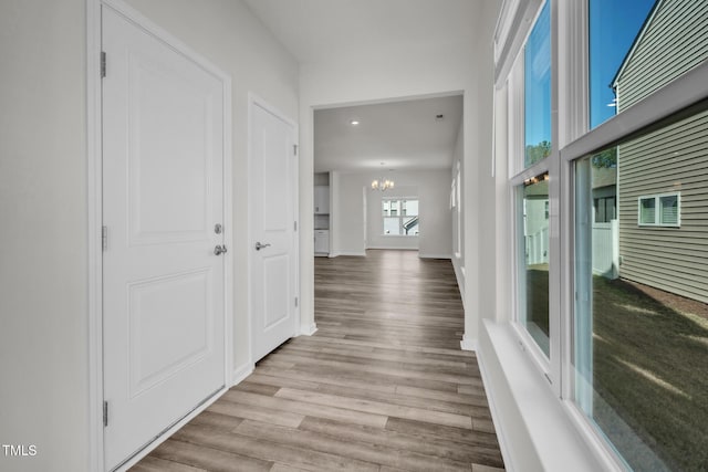 1412 Smoky Mountains St, Durham, NC 27713 - corridor featuring recessed lighting, a notable chandelier, baseboards, and wood finished floors
