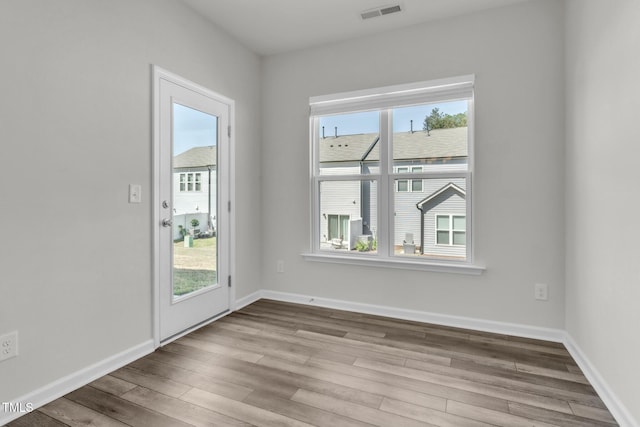 1412 Smoky Mountains St, Durham, NC 27713 - doorway to outside with wood finished floors, baseboards, and visible vents