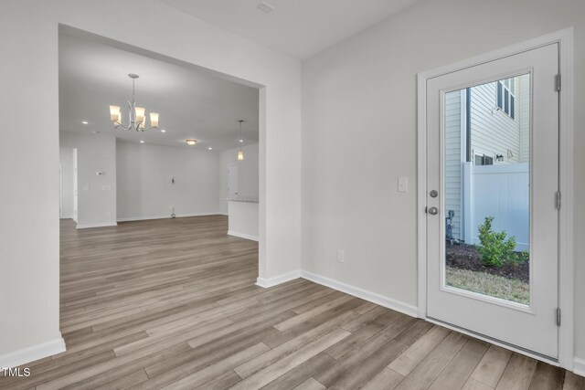 1412 Smoky Mountains St, Durham, NC 27713 - unfurnished room featuring a chandelier, recessed lighting, light wood finished floors, and baseboards