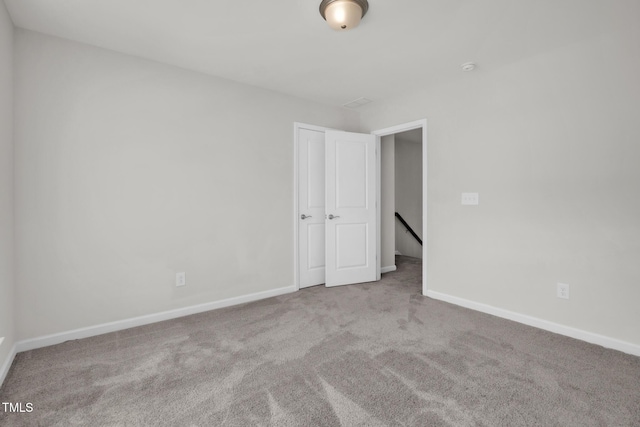 1412 Smoky Mountains St, Durham, NC 27713 - carpeted empty room featuring baseboards