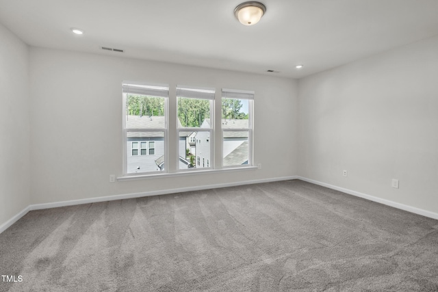 1412 Smoky Mountains St, Durham, NC 27713 - carpeted empty room with plenty of natural light, visible vents, and baseboards