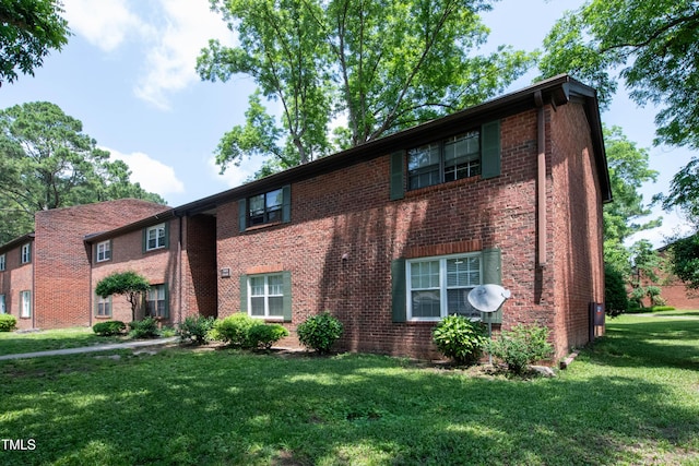 5804 Falls Of Neuse Rd Unit E, Raleigh, NC 27609 - view of front of property with brick siding and a front yard