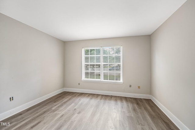5804 Falls Of Neuse Rd Unit E, Raleigh, NC 27609 - spare room with light wood-style floors and baseboards