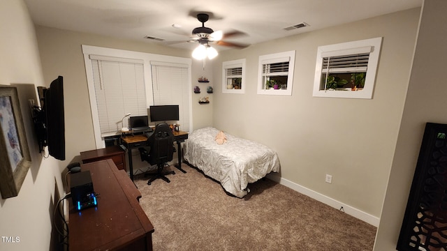 bedroom with visible vents, carpet flooring, baseboards, and a ceiling fan