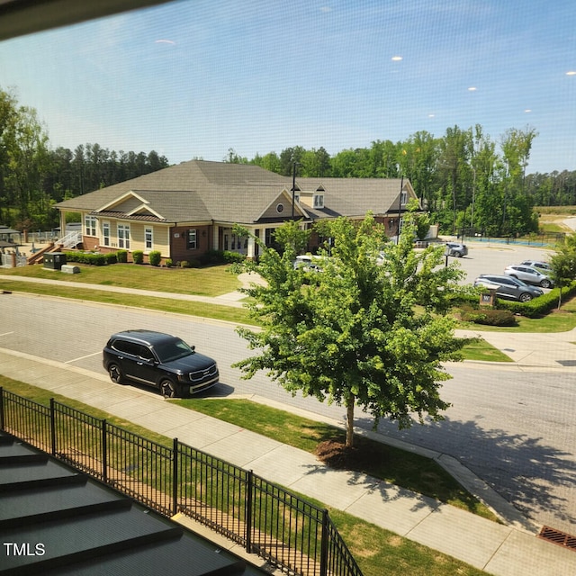 view of road featuring sidewalks and curbs