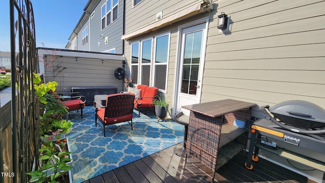 deck featuring a patio and a grill