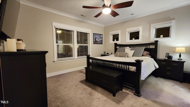 bedroom featuring carpet flooring, crown molding, visible vents, and baseboards