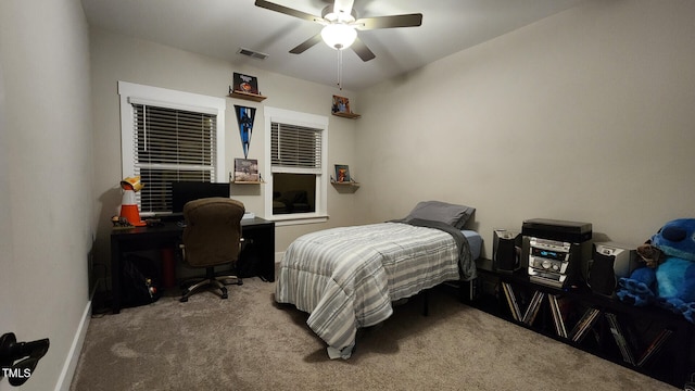 bedroom featuring carpet floors, baseboards, a ceiling fan, and visible vents