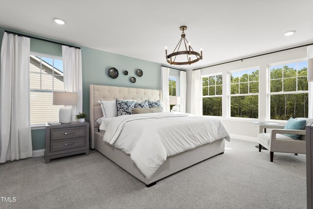 211 Faith Ave, Sanford, NC 27330 - bedroom featuring a notable chandelier, multiple windows, and baseboards