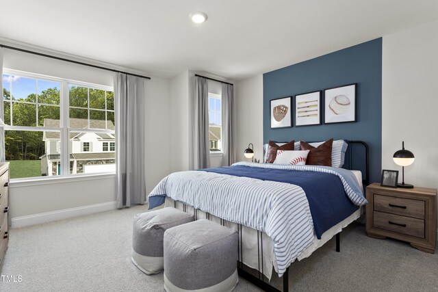 211 Faith Ave, Sanford, NC 27330 - carpeted bedroom featuring baseboards and multiple windows