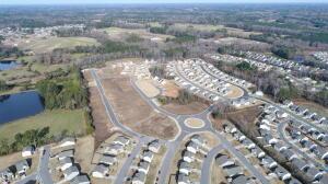 817 Kenyon Springs Dr, Zebulon, NC 27597 - aerial overview of property's location with a large body of water