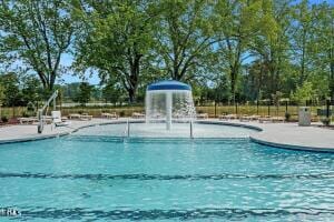 817 Kenyon Springs Dr, Zebulon, NC 27597 - community pool with a patio area