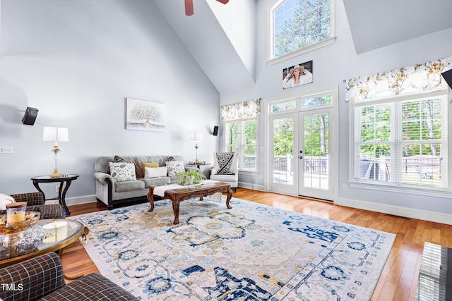 215 Terrell Dr, Rolesville, NC 27571 - living area featuring a high ceiling, ceiling fan, baseboards, and wood finished floors
