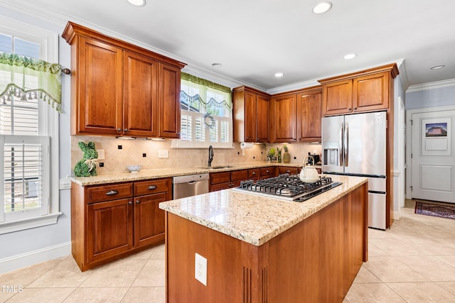 215 Terrell Dr, Rolesville, NC 27571 - kitchen featuring stainless steel appliances, a sink, baseboards, light tile patterned floors, and ornamental molding