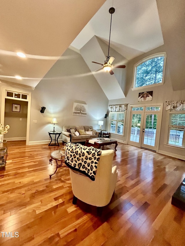 215 Terrell Dr, Rolesville, NC 27571 - living room featuring light wood-style floors, high vaulted ceiling, french doors, a ceiling fan, and baseboards