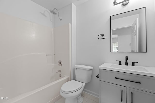 full bathroom with vanity, baseboards, toilet, and  shower combination