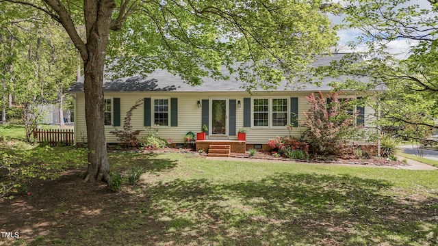 700 Sawmill Rd, Raleigh, NC 27615 - back of house featuring a lawn, crawl space, fence, and roof with shingles