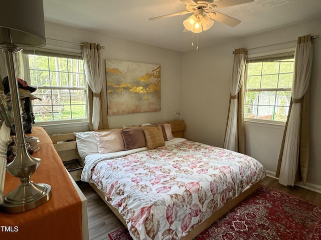 700 Sawmill Rd, Raleigh, NC 27615 - bedroom with ceiling fan, baseboards, and wood finished floors