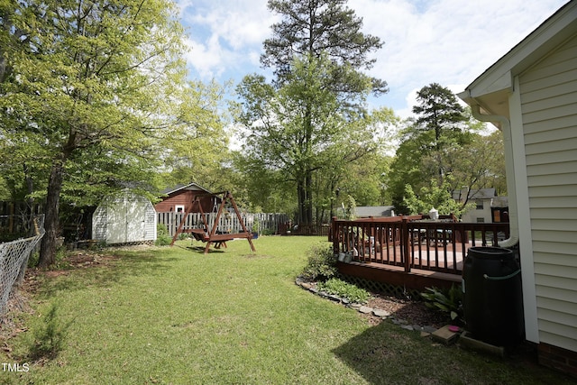700 Sawmill Rd, Raleigh, NC 27615 - view of yard with a fenced backyard, an outdoor structure, a deck, and a storage unit