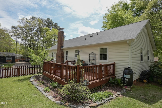 700 Sawmill Rd, Raleigh, NC 27615 - back of house with fence, a chimney, a yard, and a deck
