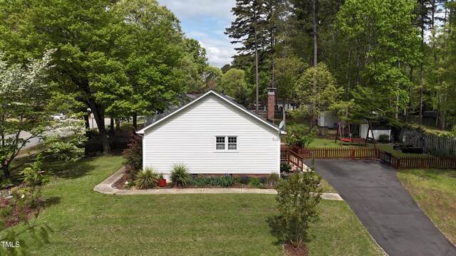 700 Sawmill Rd, Raleigh, NC 27615 - view of side of home featuring a lawn and fence
