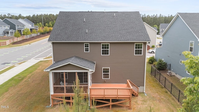3700 Horton Hill Dr, New Hill, NC 27562 - back of property with a sunroom, a shingled roof, and a deck