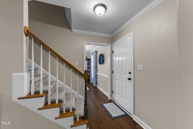 entrance foyer with crown molding, stairs, baseboards, and wood finished floors