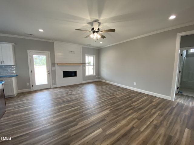 unfurnished living room featuring recessed lighting, baseboards, a ceiling fan, and dark wood-style floors