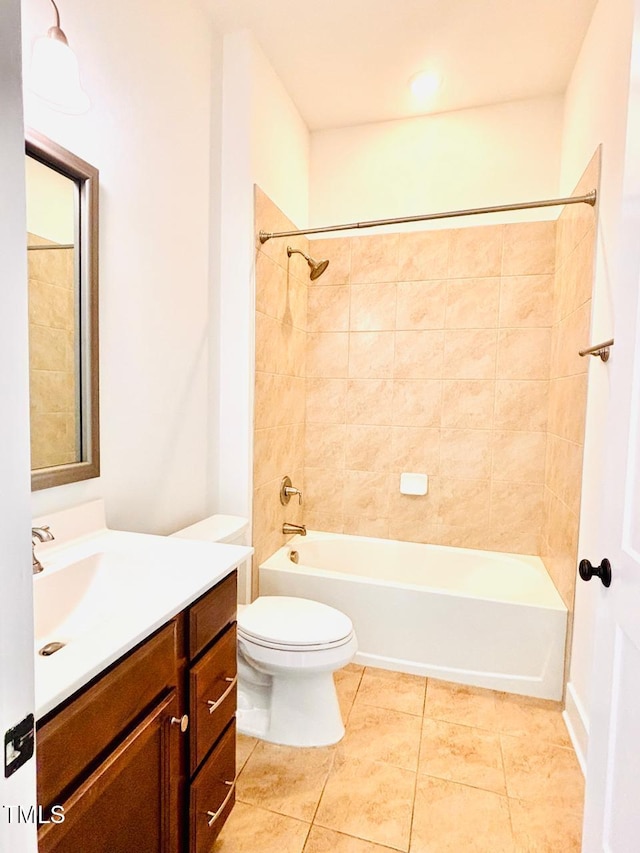 bathroom featuring toilet, tile patterned floors, vanity, and bathtub / shower combination