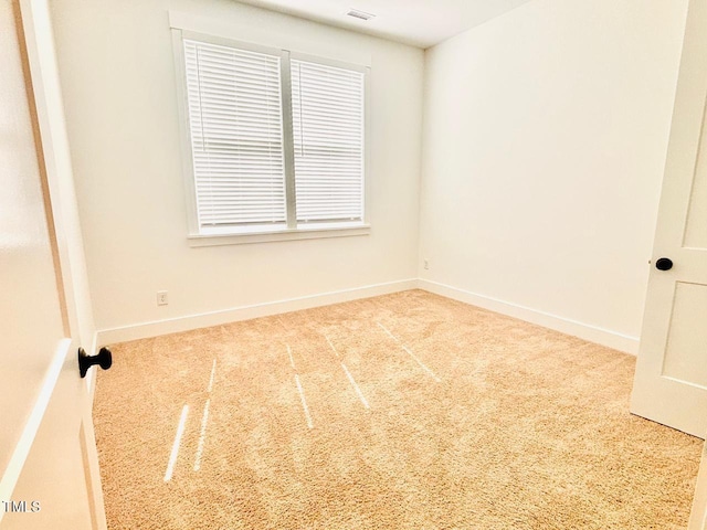 carpeted empty room with baseboards and visible vents