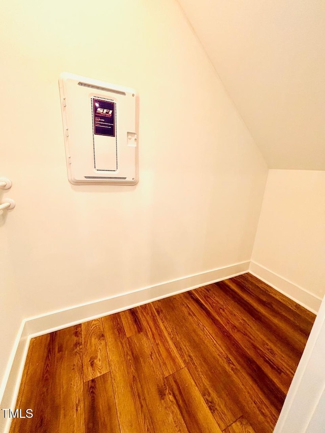 bonus room featuring lofted ceiling, baseboards, and wood finished floors
