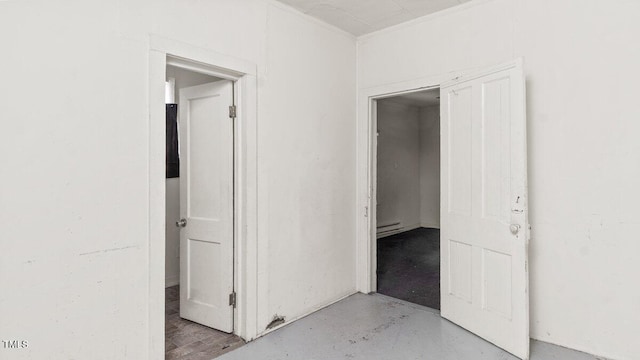 905 David St, Henderson, NC 27536 - hallway featuring ornamental molding, a baseboard radiator, and finished concrete flooring