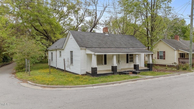 905 David St, Henderson, NC 27536 - bungalow with roof with shingles, a chimney, and covered porch