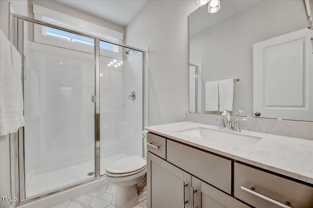 full bath featuring vanity, toilet, a stall shower, and tile patterned floors