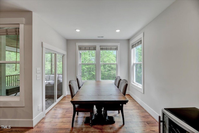 dining area with visible vents, wood finished floors, baseboards, and recessed lighting